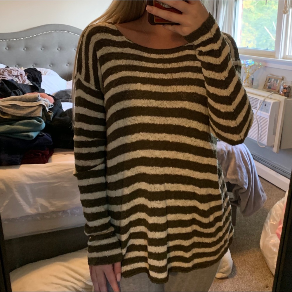 Striped dark green and white sweater.